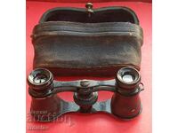 Antique military binoculars with leather case