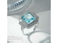 Ring with aquamarine and zircons