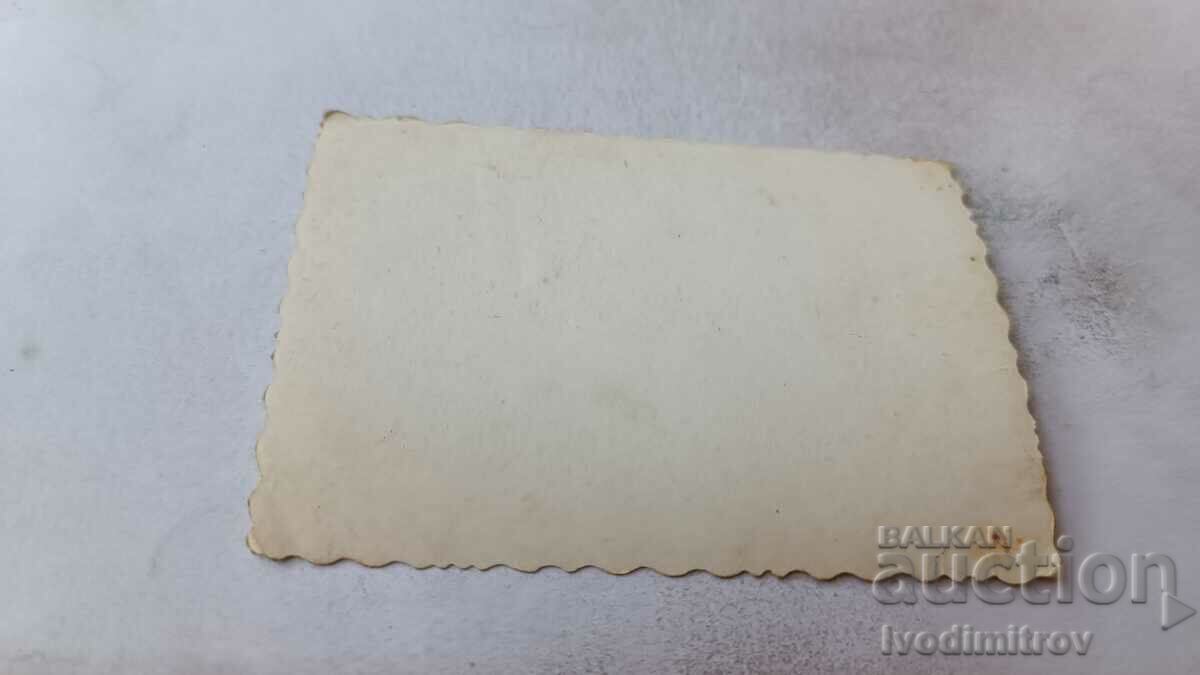 Photo Sofia Two men sitting on chairs in front of a shop with price 2.45 BGN | € 1.25 Photo Sofia Two men sitting on chairs in front of a shop with price 2.45 BGN | € 1.25