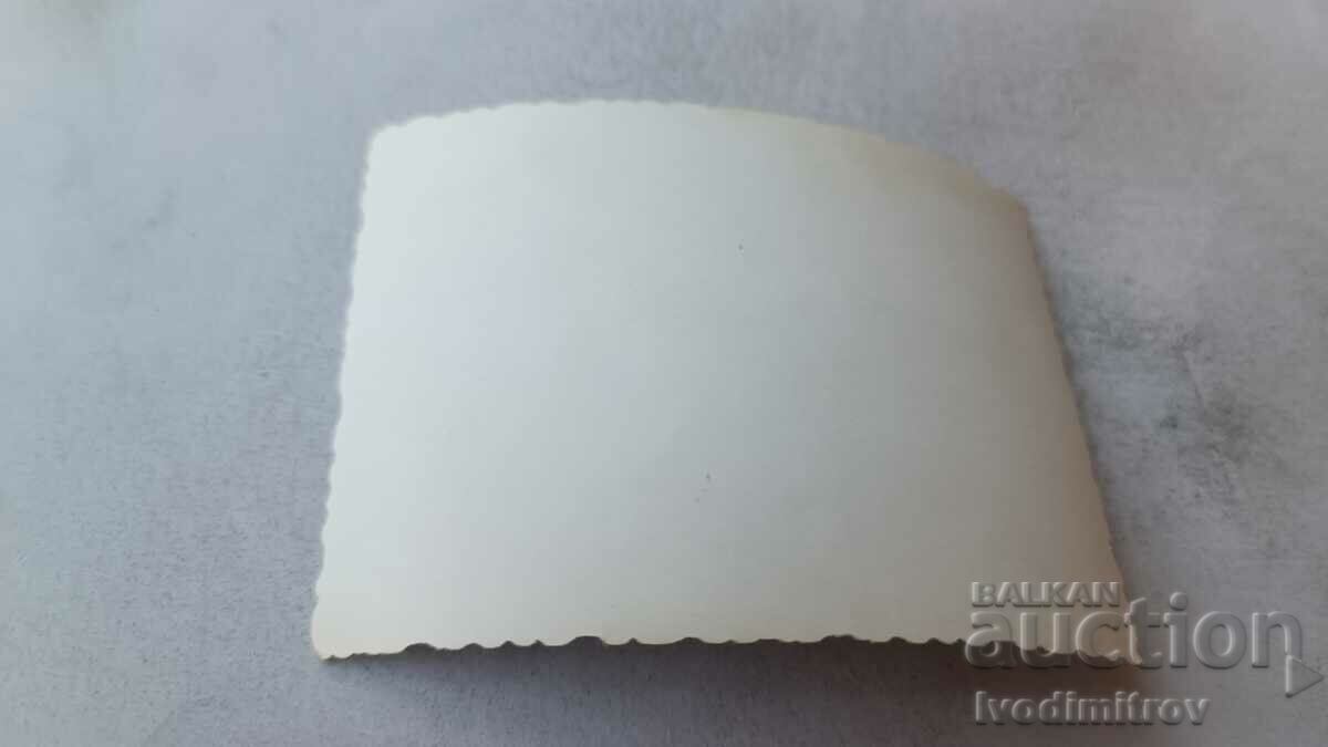 Photo Four men, a woman and children on the beach with price 1.85 BGN | € 0.95