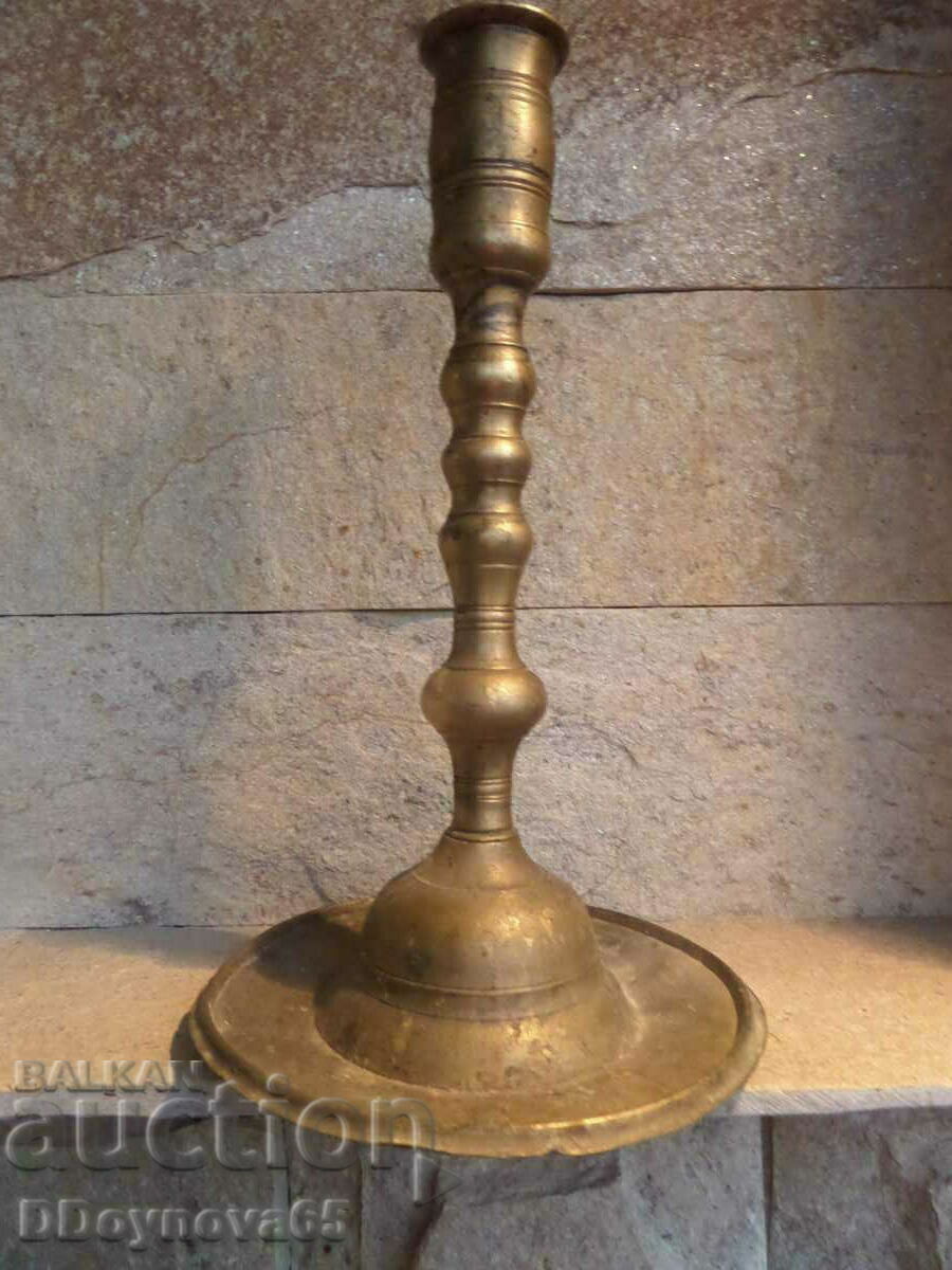 Old bronze church candlestick