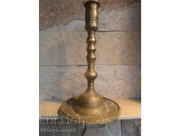 Old bronze church candlestick