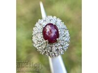 A magnificent sterling silver ring with a natural star ruby