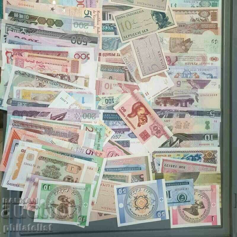 Pack of different 100 banknotes all over the world - different
