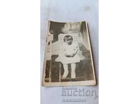 Photo Little girl on a wooden chair