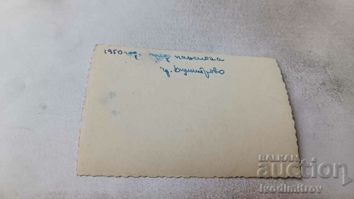 Photo Dimitrovo Young men in front of Pension 1950 with price 2.45 BGN | € 1.25