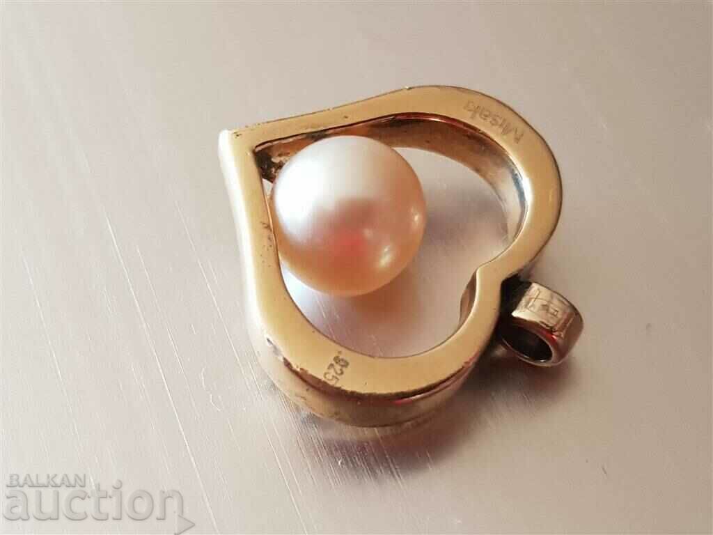 Delivery of Beautiful and romantic silver locket with gilding and pearl Delivery of Beautiful and romantic silver locket with gilding and pearl