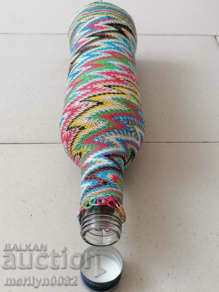 Delivery of Old glass bottle with colorful braid bottle, glass Delivery of Old glass bottle with colorful braid bottle, glass