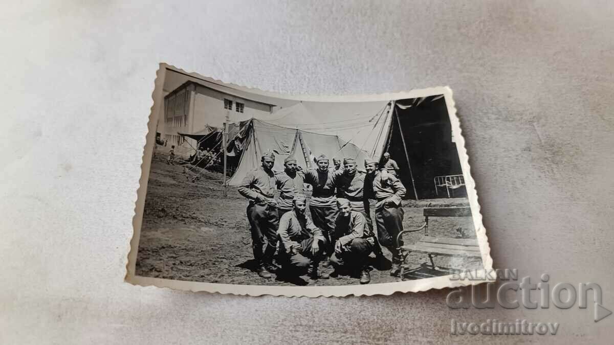 Photo Soldiers in front of tents in the yard of the barracks