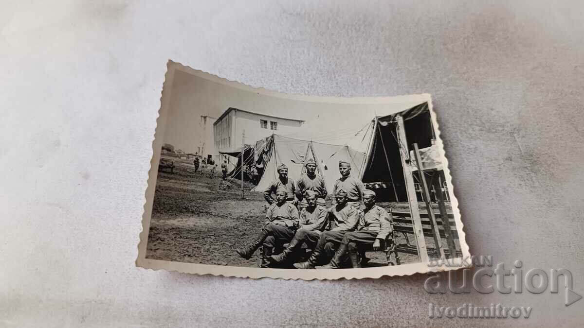 Photo Soldiers in front of tents in the yard of the barracks