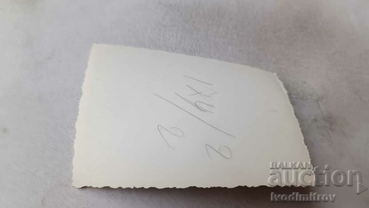 Photo A young man and three young girls on a stone in the river with price 1.35 BGN | € 0.69