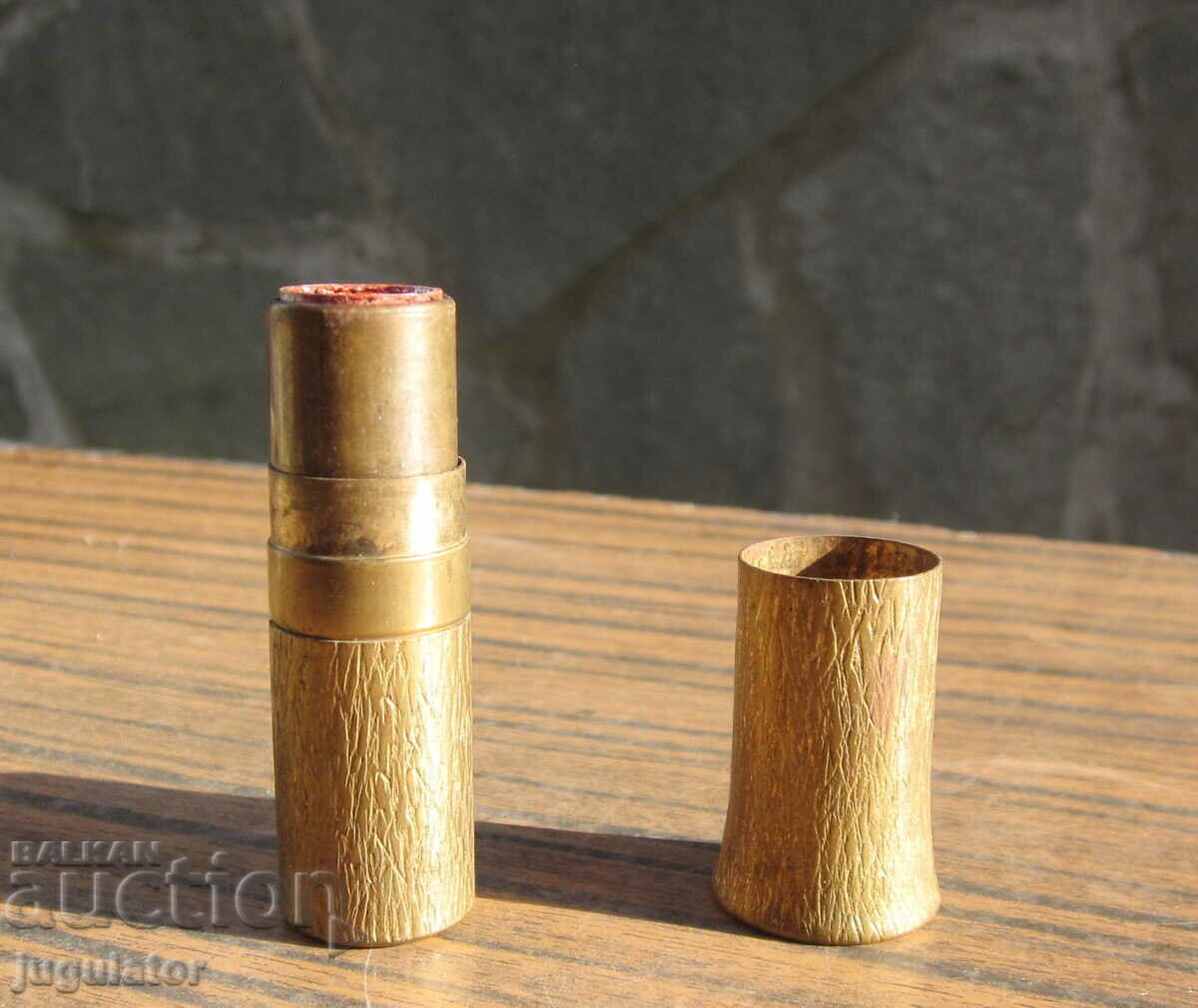 old bronze box of Bulgarian lipstick
