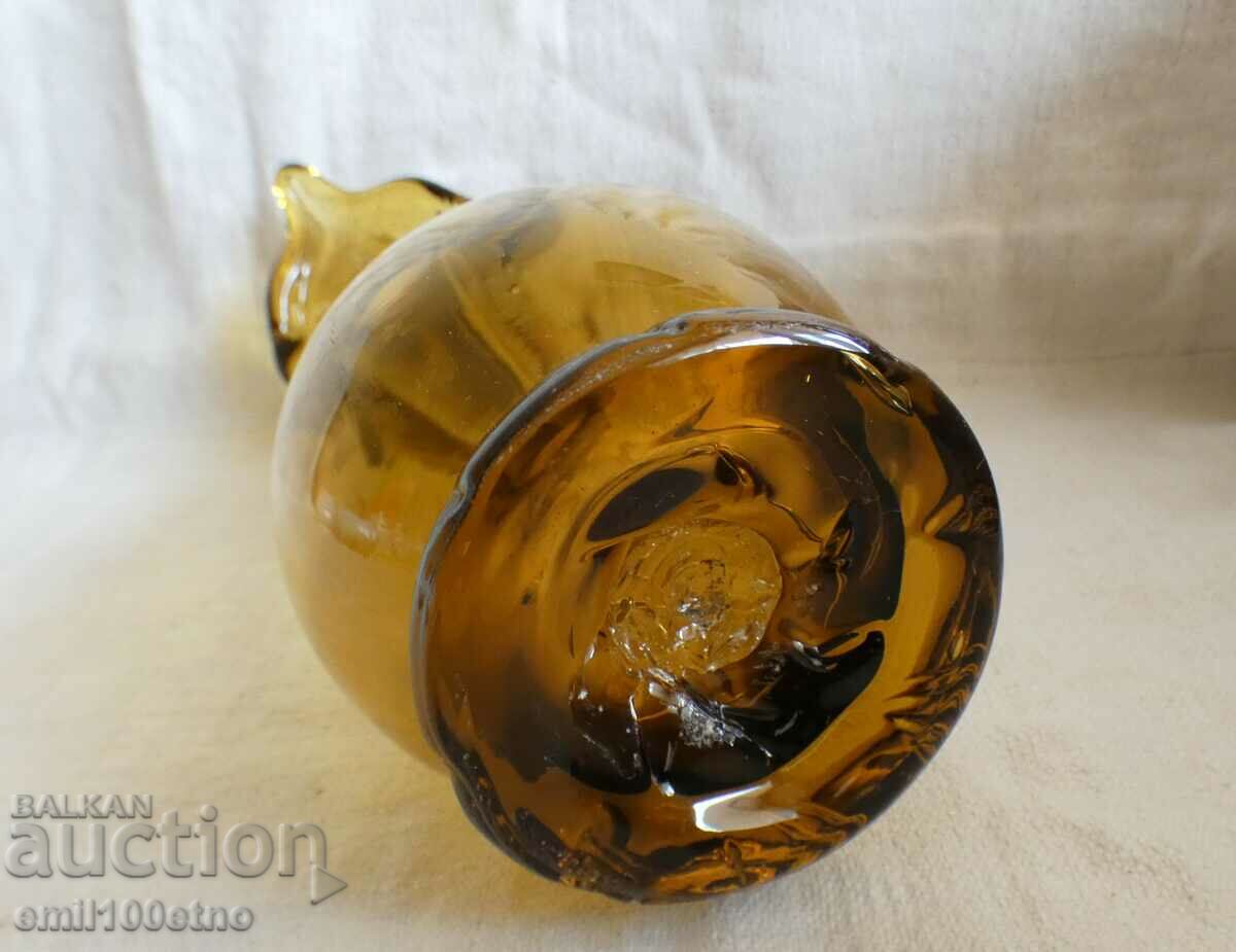 Delivery of A beautiful vase of colored glass with a floral motif, handmade