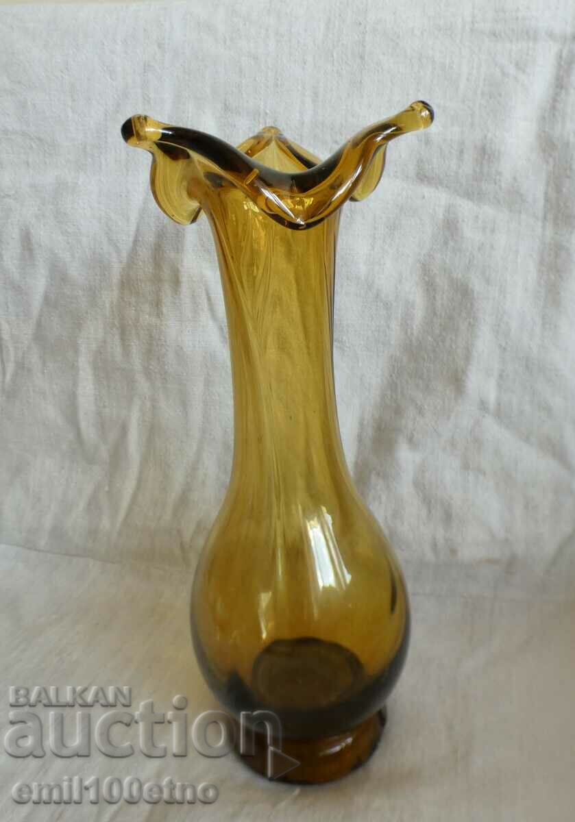 A beautiful vase of colored glass with a floral motif, handmade