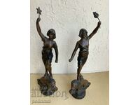 A pair of antique metal figurines