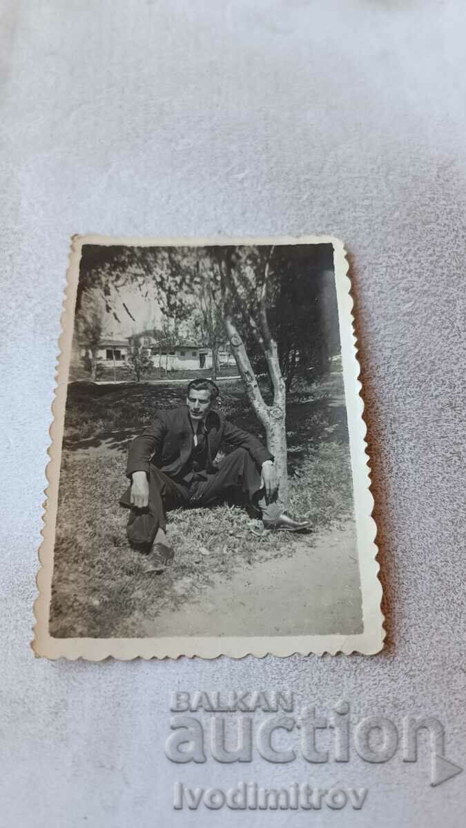 Photo Sofia A man sitting on the grass by the road 1941