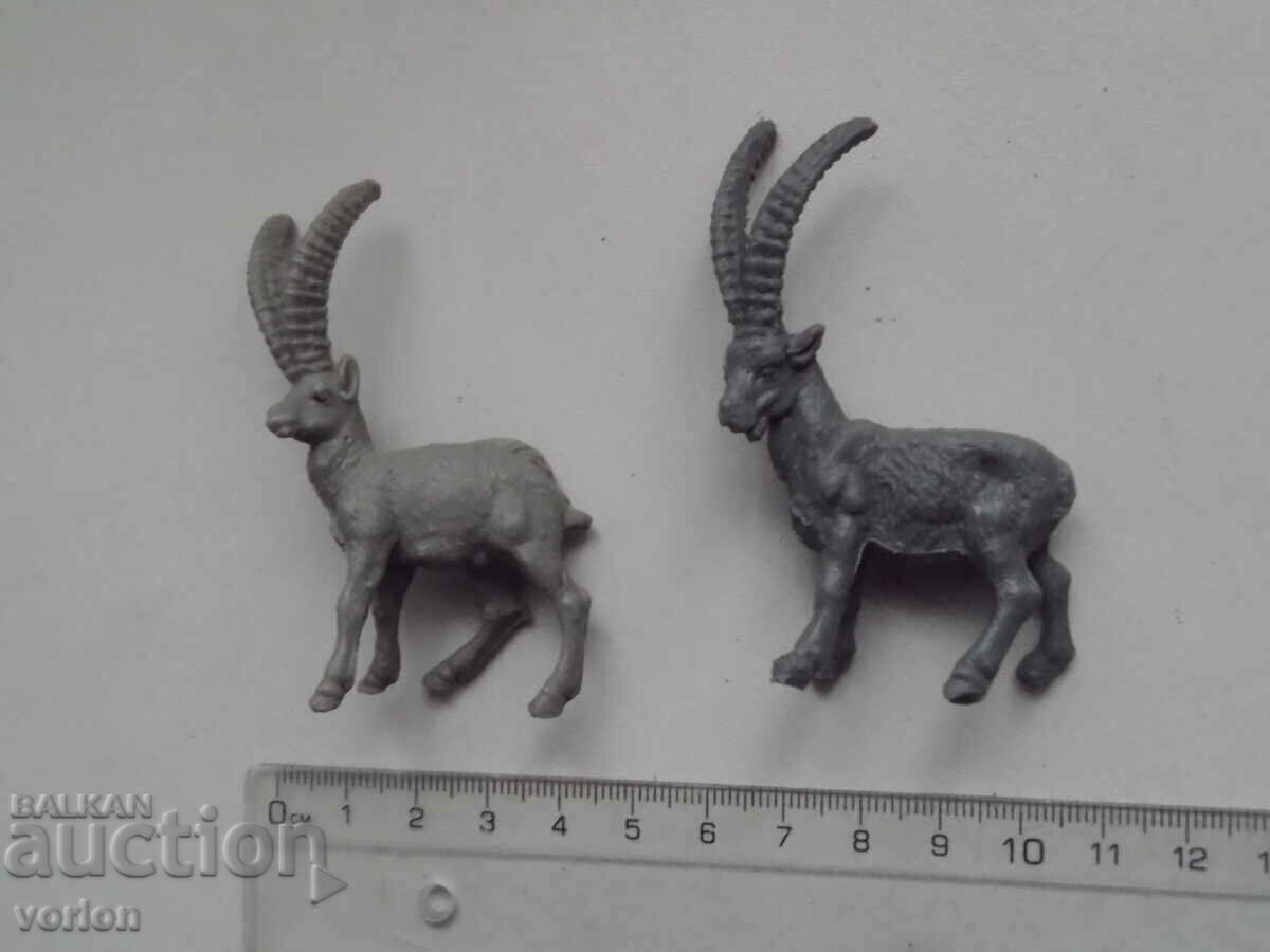 Figura, animale: capricorni, ibex.