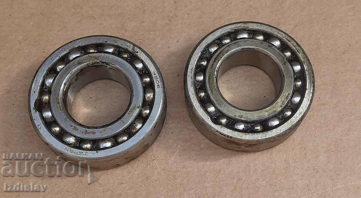 Two Japanese double-row self-aligning ball bearings.