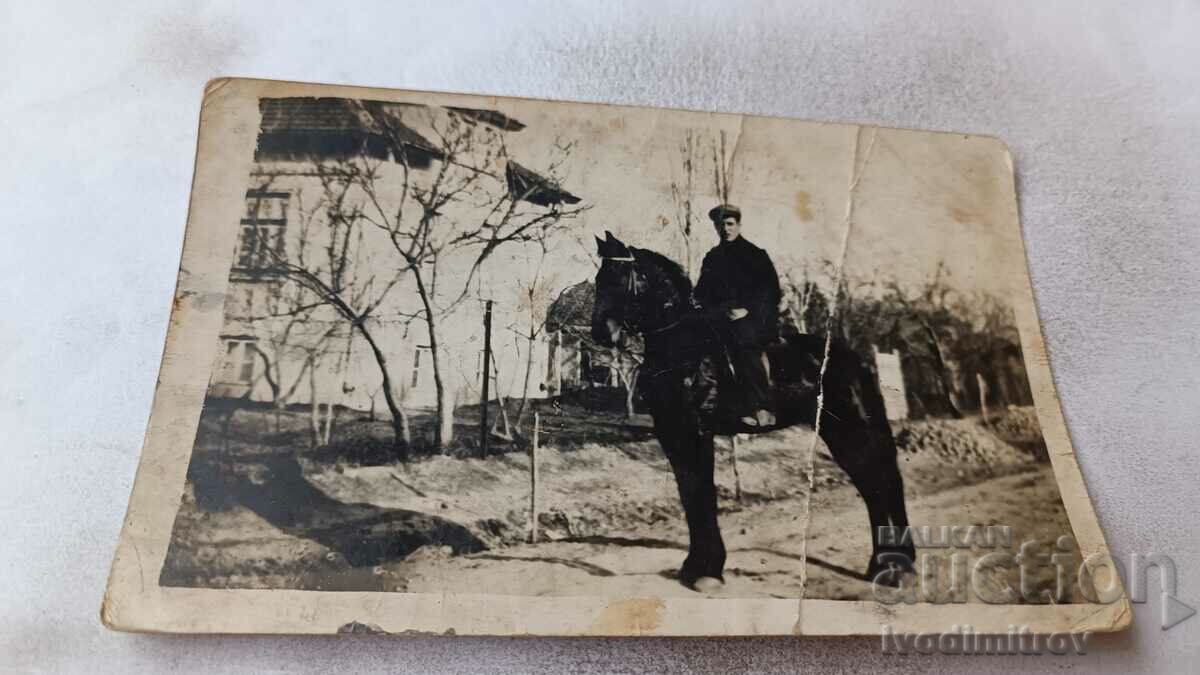 Photo Bosnian Man on a black horse