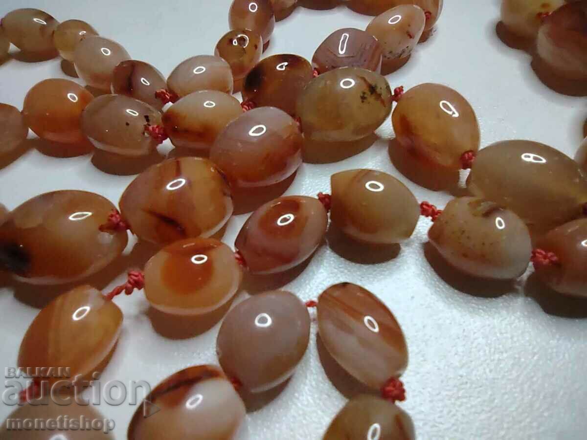 Delivery of Amber necklace with a length of 88 cm and a weight of 97 g. Delivery of Amber necklace with a length of 88 cm and a weight of 97 g.