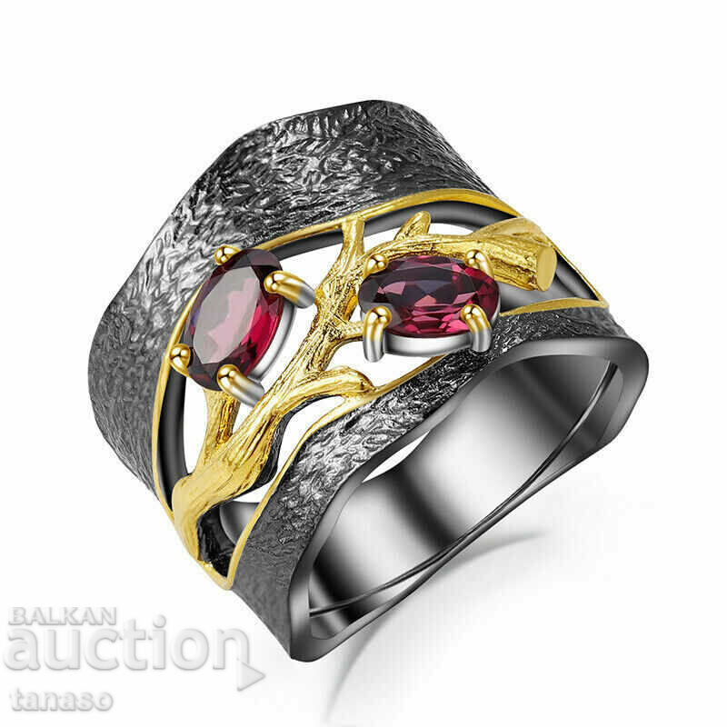 Ring with a red garnet, rhodium