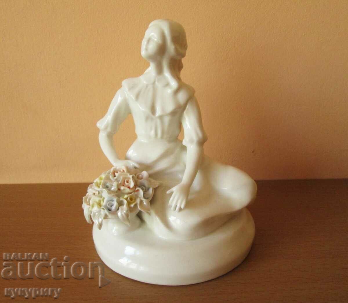 A delicate porcelain figure figurine