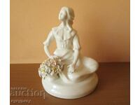 A delicate porcelain figure figurine
