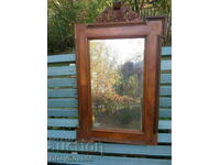 Old faceted mirror, wood carving