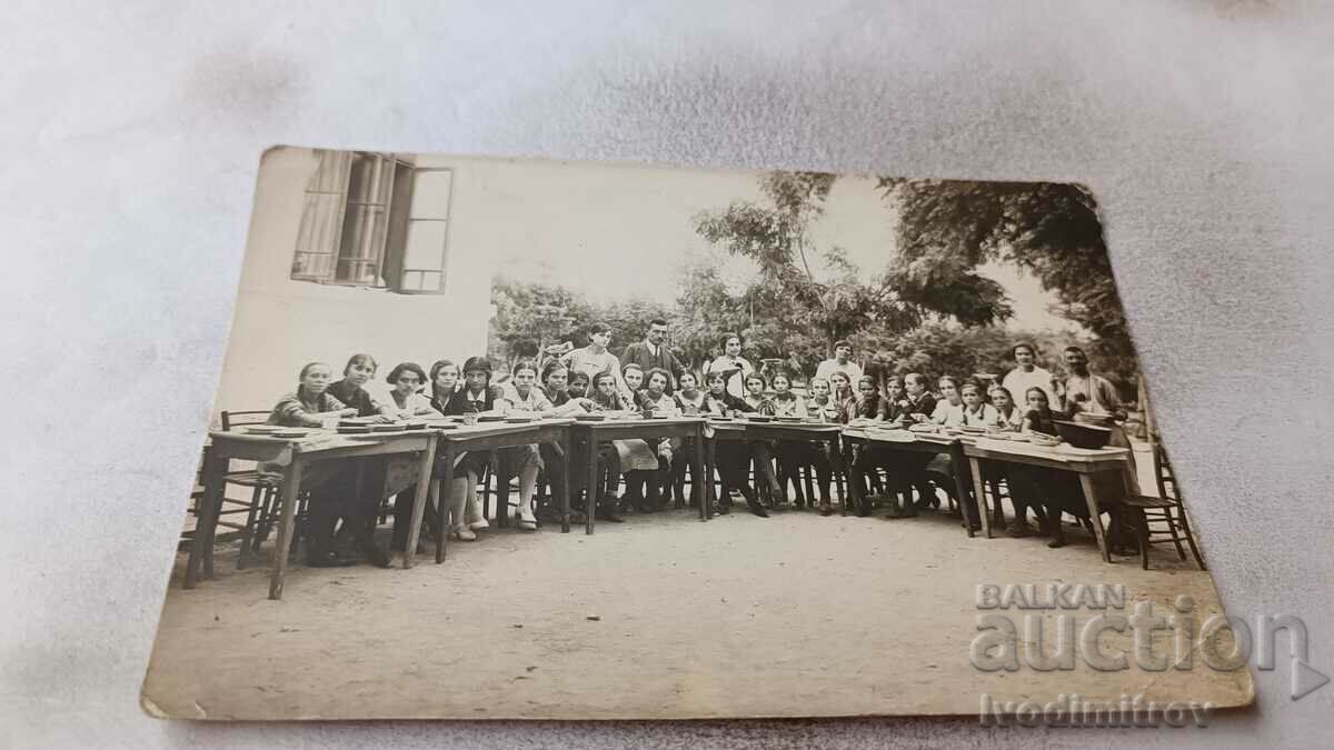 Photo Pupils and teachers in the school yard