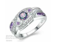 Ring with aquamarine and violet zircons
