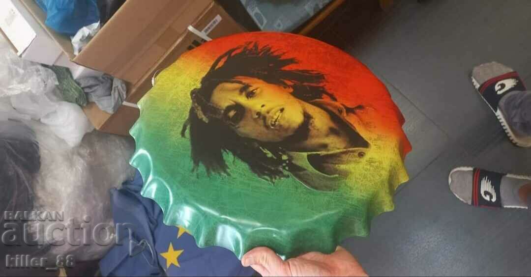 Metal sign in the shape of a Bob Marley cap