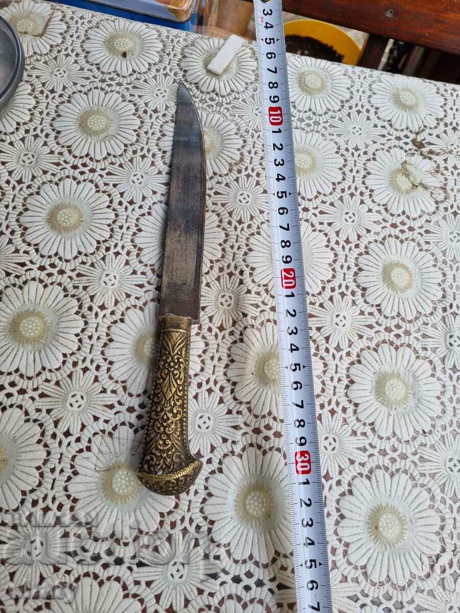 Old knife with bronze handle