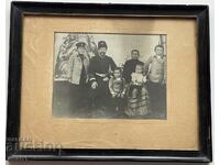 Photograph of a military man with his family in a frame