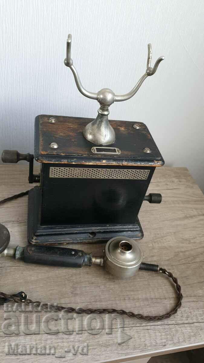 Delivery of A rare early 20th century two crank telephone