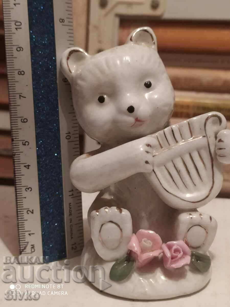 Porcelain figure, a bear with a harp