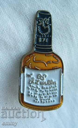 Whiskey bottle badge