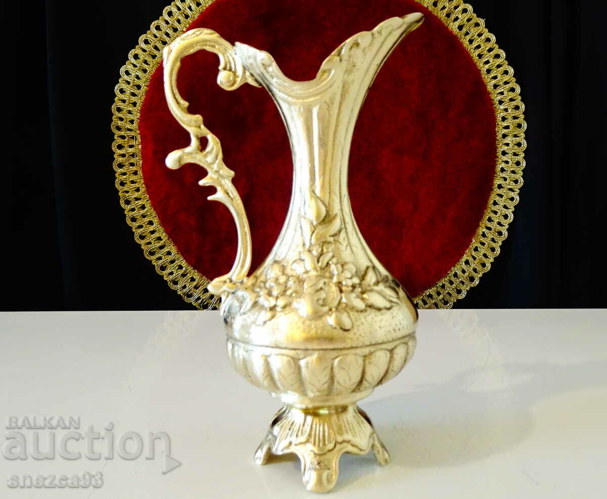 Bronze jug, roses, baroque.
