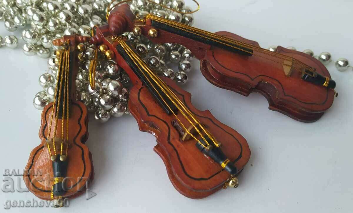 Lot of small wooden violins for decoration