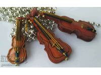 Lot of small wooden violins for decoration