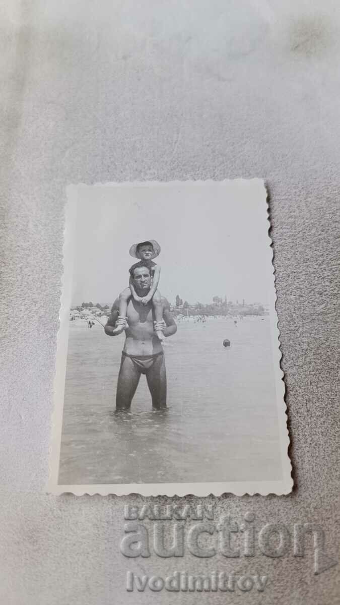 Снимка Приморско Мъж и момченцец на брега на морето 1963