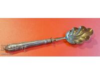 Antique spoon with silver handle.