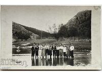 Photograph of friends in the river