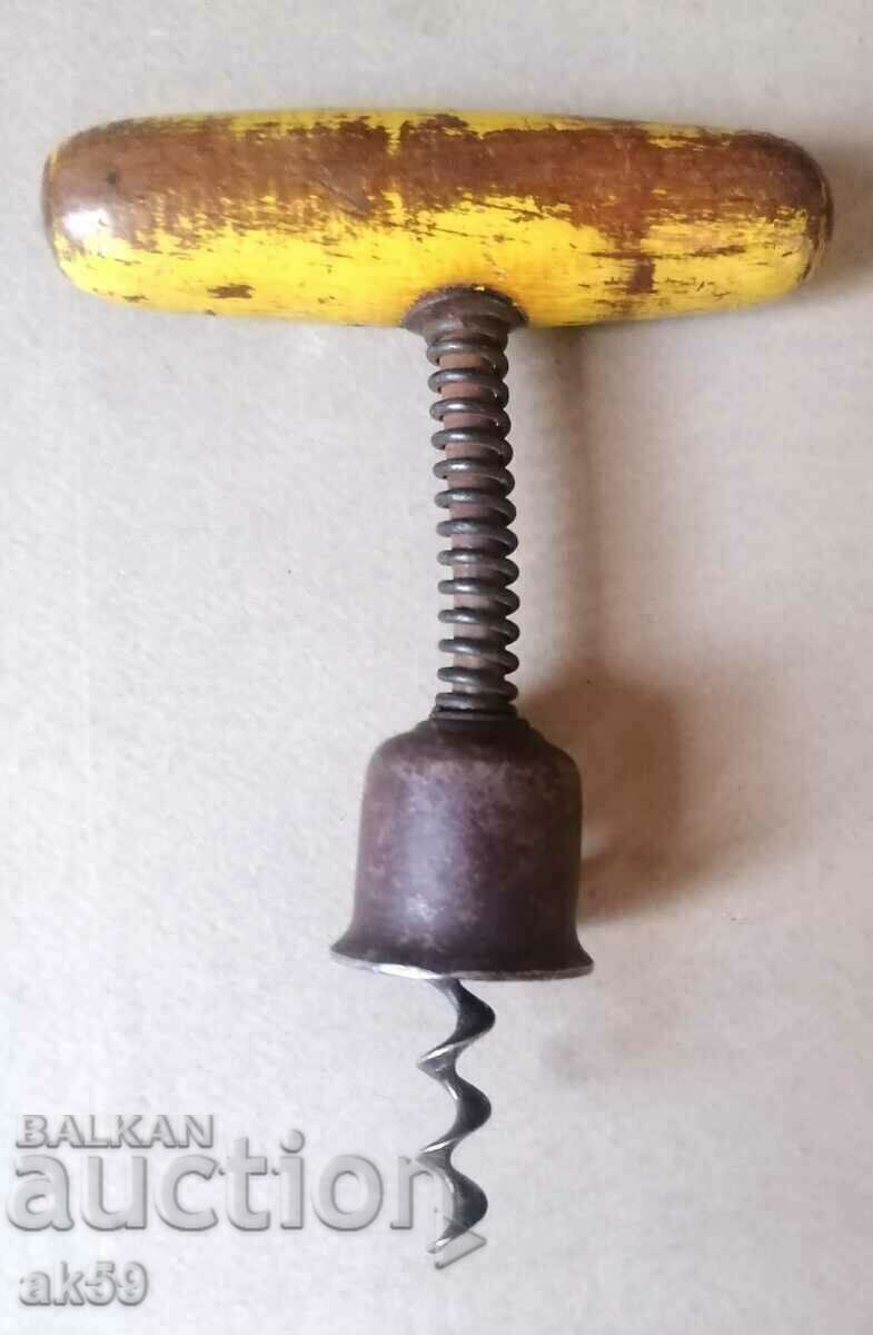 Old corkscrew with a bell.