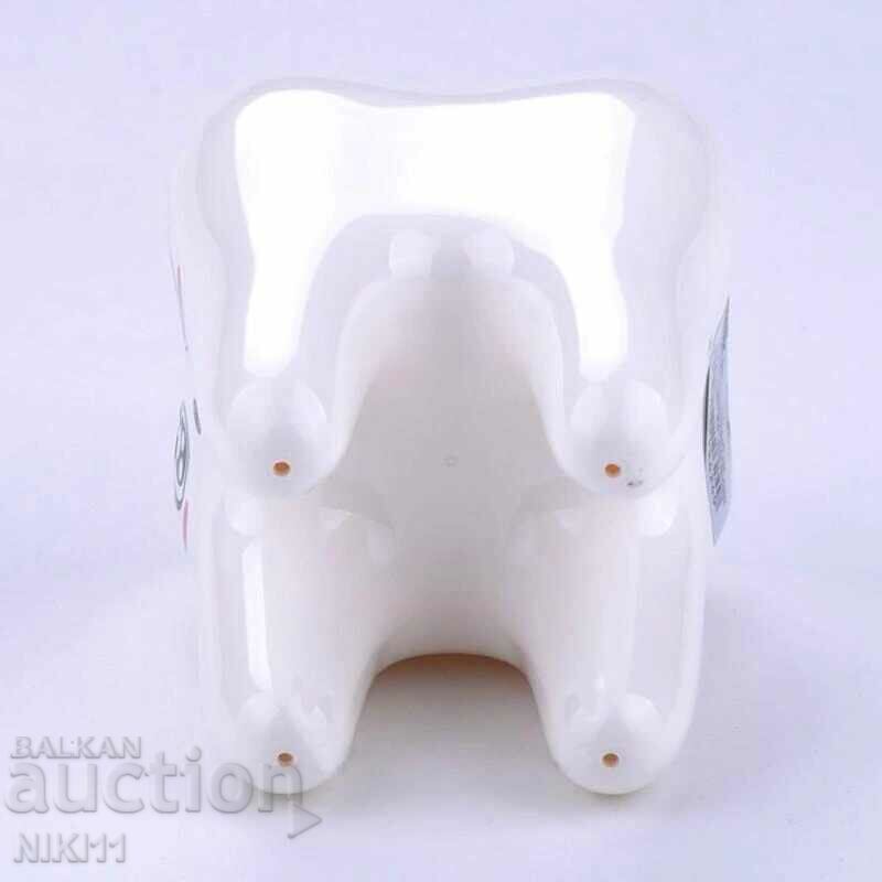Toothbrush holder in the shape of a tooth with price 12.00 BGN | € 6.14
