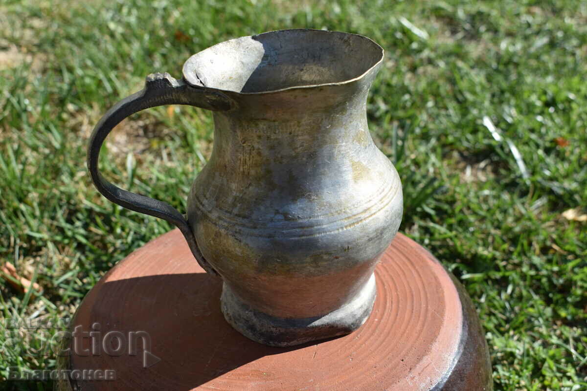 Old wrought copper jug