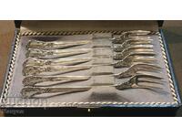 I am selling a set of old silver oyster cutlery.