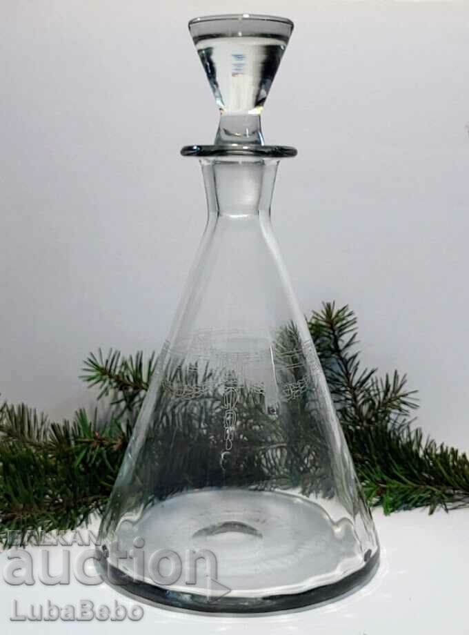 Carafe of hand-blown and engraved glass.