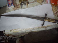 Old bayonet with bronze handles.