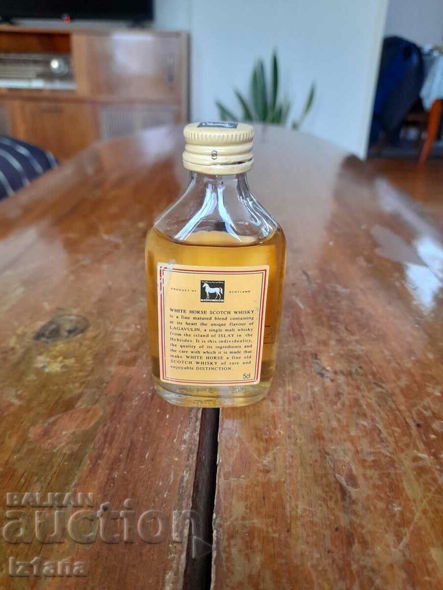 Delivery of Old bottle of White Horse Whiskey Delivery of Old bottle of White Horse Whiskey