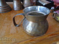 a large copper cauldron, massive, caldised, forged
